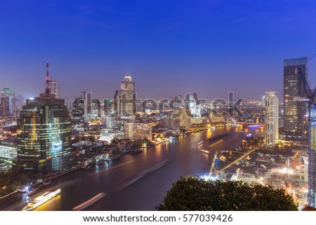 Aerial view of modern building business district and Chaophraya river in bangkok, Thailand.