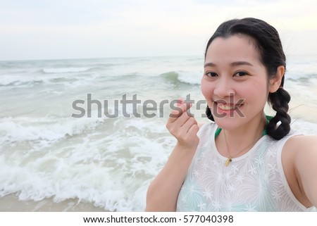 selfie Thai woman at the beach, self portrait