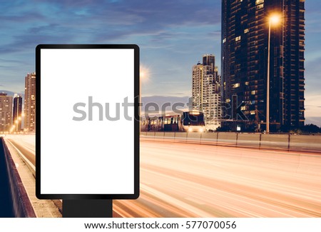 Blank template for outdoor advertising or blank billboard on the highway during the twilight. With clipping path on screen - can be used for trade shows, and advertising or promotional poster.