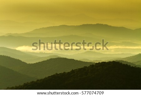 Misty dawn at the Smoky Mountains in North Carolina seen from the Blue Ridge Parkway