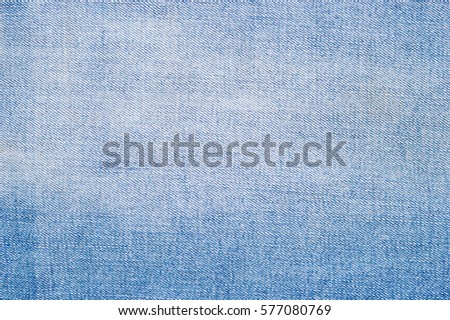 Blue jeans fabric textile close up texture background.