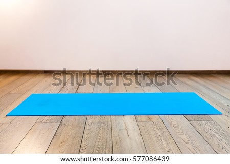 Gym with yoga mat interior Royalty-Free Stock Photo #577086439