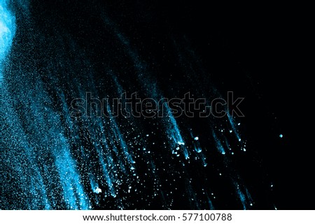 abstract blue dust explosion on  black background.abstract blue powder splatted on black background,Freeze motion of blue powder exploding.