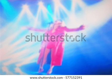 Abstract blurred image of a concert. Performances of artists in bright colorful scenes. spectators enjoyed a great show.