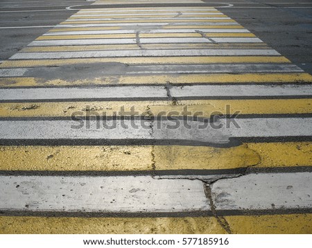 Yellow white Pedestrian zebra.