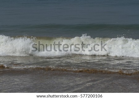 Waves on the coast of the warm sea