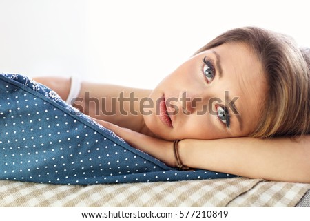 Picture showing sad woman resting on sofa