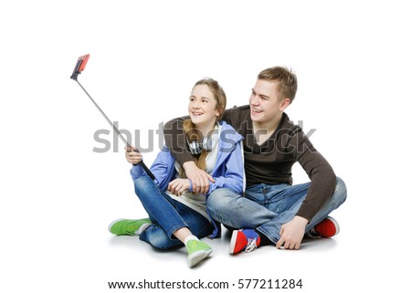 Teen boy and girl taking selfie photo