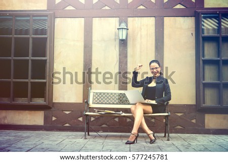 Business woman sitting Working outdoor