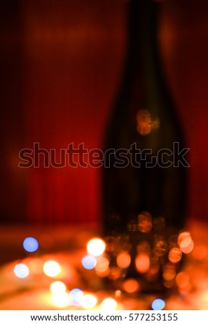 Blurry dots and black background. Vertical compositon. Colorful picture.