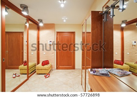 Elegance anteroom interior in warm tones with hallstand and mirror Royalty-Free Stock Photo #57726898