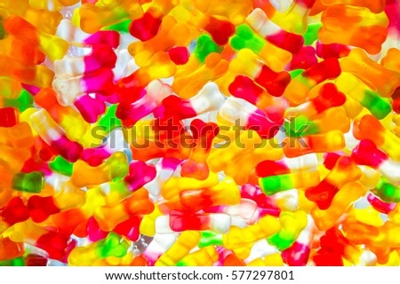 Jujube in sugar absence bone shape, colorful abstract texture background, back light, closeup