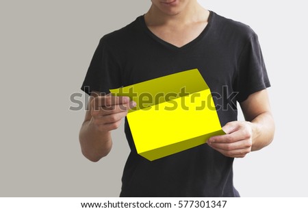 Man reading blank yellow flyer brochure booklet. Leaflet presentation. Pamphlet hold hands. Man show clear offset paper. Sheet template