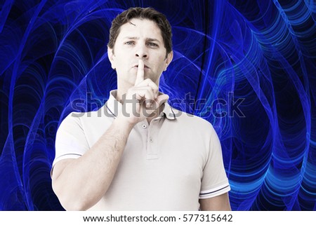 A young man is showing the silent sign: he is keeping his right index in front of his mouth; a blue electric field full of waves is in the background