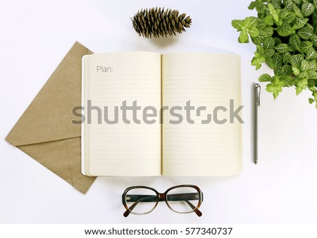 notebook for working notes, glasses, pen. Plan 2017. 