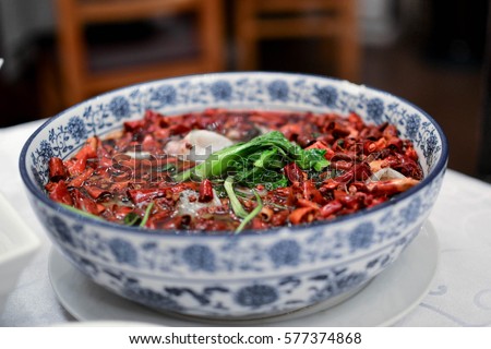 Traditional Chinese hot pot with Szechuan chilli peppers Royalty-Free Stock Photo #577374868