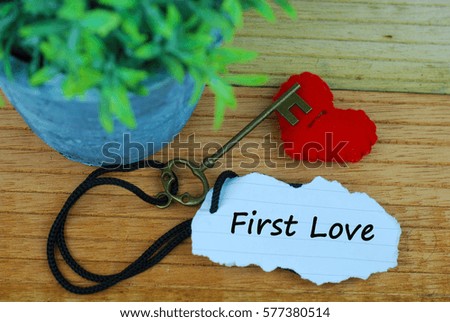 Key and heart as symbol of love with text my first love