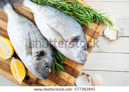 Raw ingredients - dorado fish and vegetable, cooking baked fish