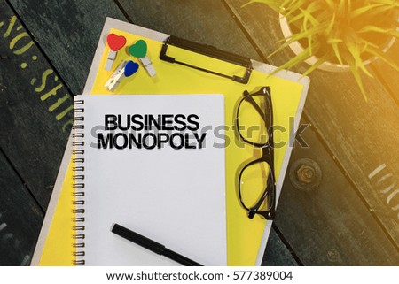 Business concept - Top view notebook writing Business Monopoly