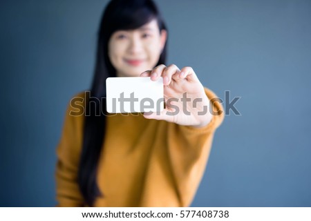 Woman holding blank business card for mock up
