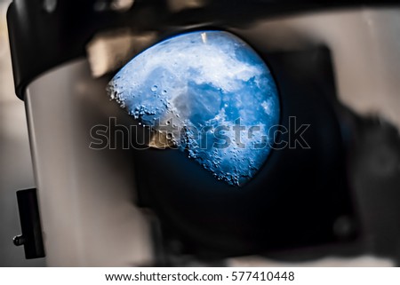 Half moon surface seen at telescope, astronomy background, science photo