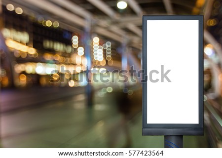 Blank mock up of vertical street poster billboard on bangkok city thailand for your advertising with bokeh blur, Empty billboard with copy space area for your text message or promotional content.