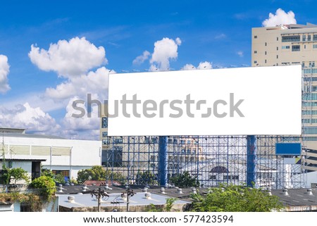 Billboard blank for outdoor advertising poster with residence buildings in bangkok thailand and blue sky with cloud. can advertisement for display or montage product and business.