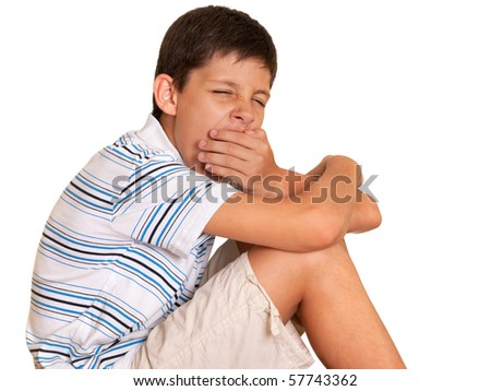 A portrait of a sleepy boy; isolated on the white background