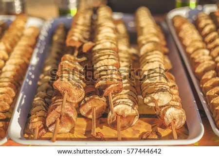 Fried potato spirals food. Royalty-Free Stock Photo #577444642