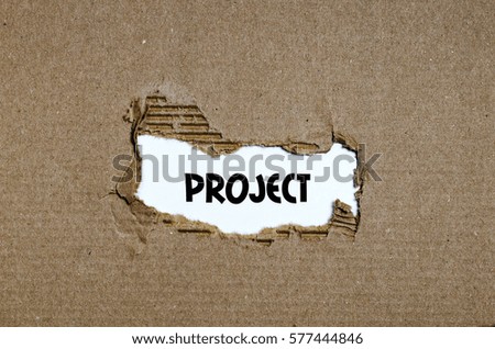 The word project appearing behind torn paper