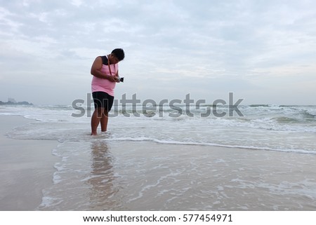 photographer taking photo at beach