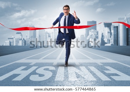 Businessman on the finishing line in competition concept Royalty-Free Stock Photo #577464865