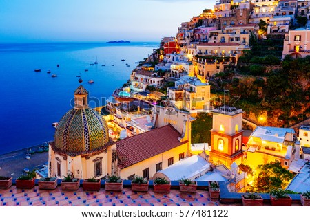 Positano, Amalfi Coast, Campania, Sorrento, Italy. View of the town and the seaside in a summer sunset Royalty-Free Stock Photo #577481122