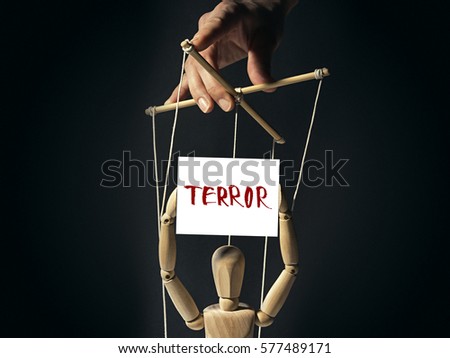 Tyrant holds a puppet on strings, in doll's hands a  banner with inscription "terror".  Image on black background.