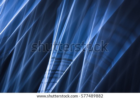 Blue abstract intersecting light streaks long-exposure photography