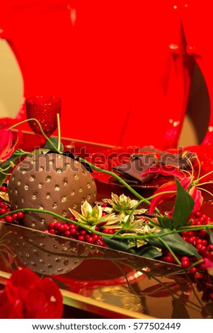Wedding decorations in red color. A decorated wedding dining table 
