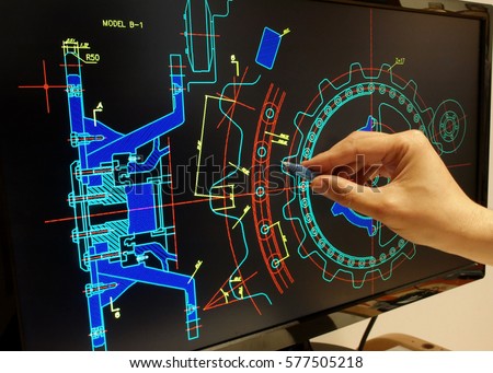 engineer working on mechanichal piece computer design    Royalty-Free Stock Photo #577505218