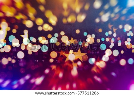 abstract blurred of blue and silver glittering shine bulbs lights background.blur of Christmas wallpaper decorations concept.xmas holiday festival backdrop:sparkle circle lit celebrations display.