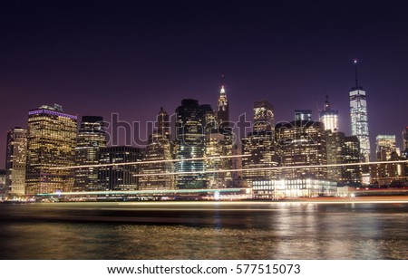 Famous Manhattan cityscape in New York with light trails