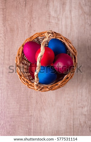 Easter egg basket, view above, wood background