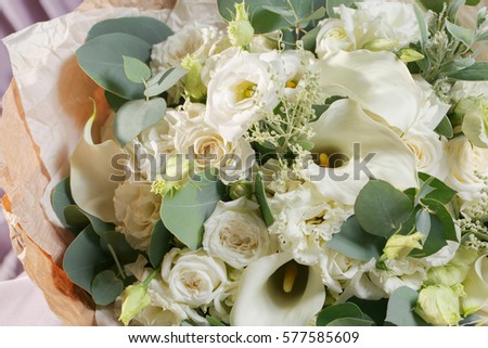 close-up beautiful bouquet made of different flowers. colorful color mix flower on a table covered with cloth