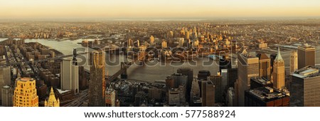 Manhattan downtown sunset rooftop panorama view with urban skyscrapers in New York City