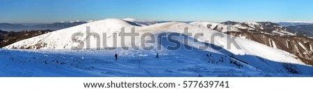 Wintry view from Velka Fatra mountains with tourist and mount Ostredok - Slovakia