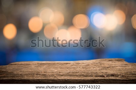 Empty wooden perspective platform with sparkling abstract blur bokeh used as template to mock up for display product