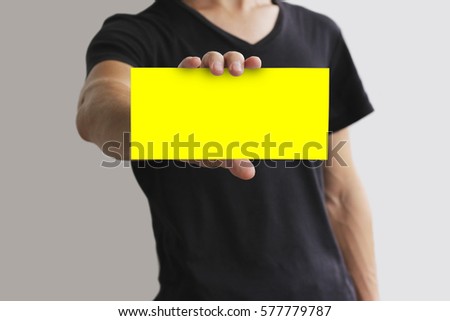 Man showing blank yellow flyer brochure booklet. Leaflet presentation. Pamphlet hold hands. Man show clear offset paper. Sheet template. Booklet design sheet display read first person.