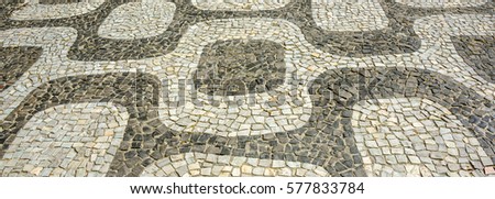 Black and white iconic mosaic, Portuguese pavement by old design pattern at Ipanema beach, Rio de Janeiro, Brazil 
