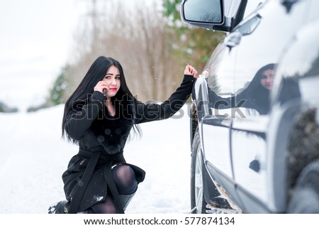 Winter car breakdown - woman call for help, road assistance