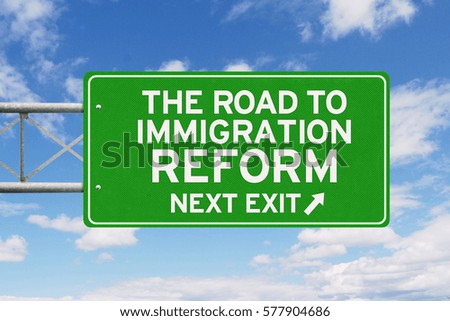 Picture of sign road with text of the road to immigration reform and arrow symbol under clear sky