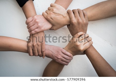Teamwork, vision, young people United Hands together expressing positive, tag team, team, friendship, spirit, one heart,  mission, connection, partnership, deal, volunteer concepts.  Royalty-Free Stock Photo #577909396