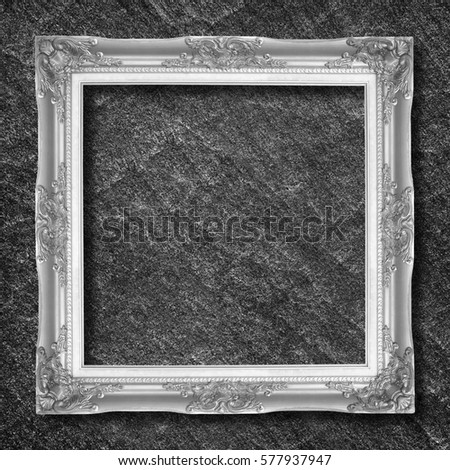 silver frame on black slate background